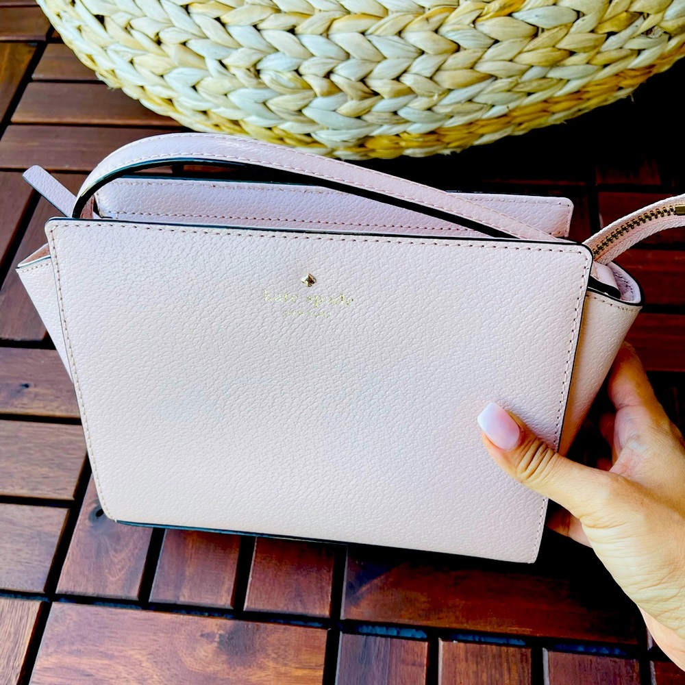 Brand new kate spade bag. Never used. Classy pink.